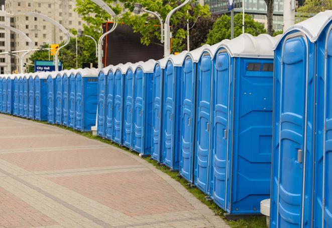 a row of sleek and modern portable restrooms at a special outdoor event in Atlanta, GA